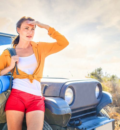 woman-in-yellow-long-sleeve-leaning-on-blue-car-3779747